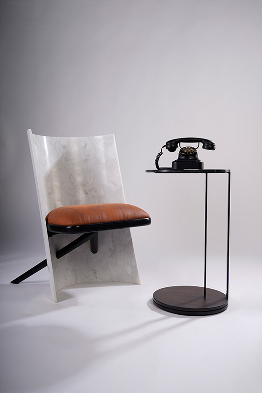 The XOXO chair by AVVO Architects emerges as a cantilevered marvel made of natural acrylic stone and water-based PU-polished Burma teak wood. Price on request (Image credits: Kanak Sharma)  