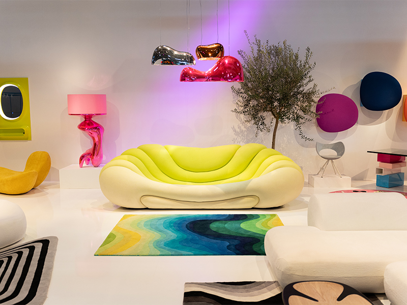 The Dreamscape Sunrise sofa with Cloud Beam pendant lights above, and the Flow Figure floor lamp to the left, is a maximalist dream come true. While on the right, the Nimbus cabinets paired with the Pixel desk embody a quaint and functional vibe. (Image Credits: Courtesy of Kare) 