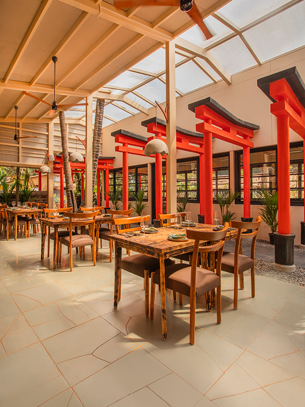 The flooring, a poetic nod to Kintsugi, brings together fragments of broken Kota stone, filled with gold grout to celebrate cracks rather than conceal them. (Image Credits: Pratidhani Tamang)