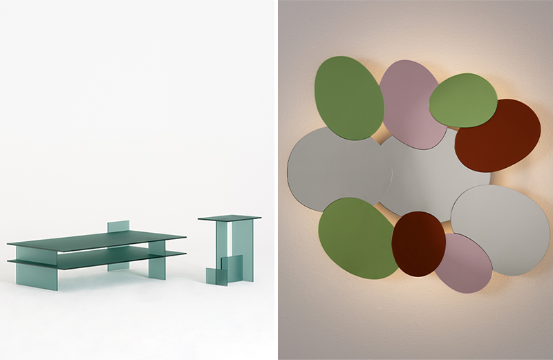 Left: Michael Anastassiades’ Kazimir is a sculptural glass collection defined by interlocking, acid-etched sheets that form pure, minimalist volumes. Right: Bouquet by Johanna Grawunder is a vibrant wall composition of ten overlapping ovoid mirrors in varied hues and sizes, radiating a soft backlit glow like a contemporary halo. (Image Credits: Courtesy of Glas Italia) 