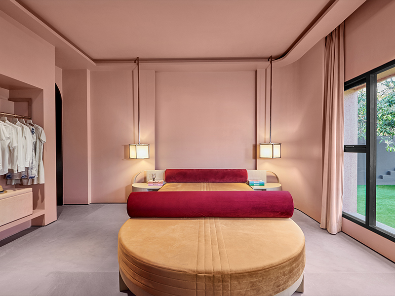 Pairing red with pastel pinks and warm beiges in the villa Privé, designed by Pinakin Studio, underscores the significance of the Unexpected Red Theory. (Image Credit: Justin Sebastian) 