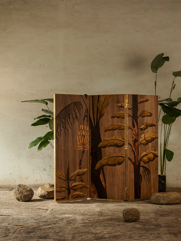 The Vanar Tirai room divider is a captivating piece of inlay work that tells a story. With monkey and banana foliage on each side, it represents India’s Mythology and Agricultural Heritage. 
Price on request | Image credits: Saurabh Suryan
