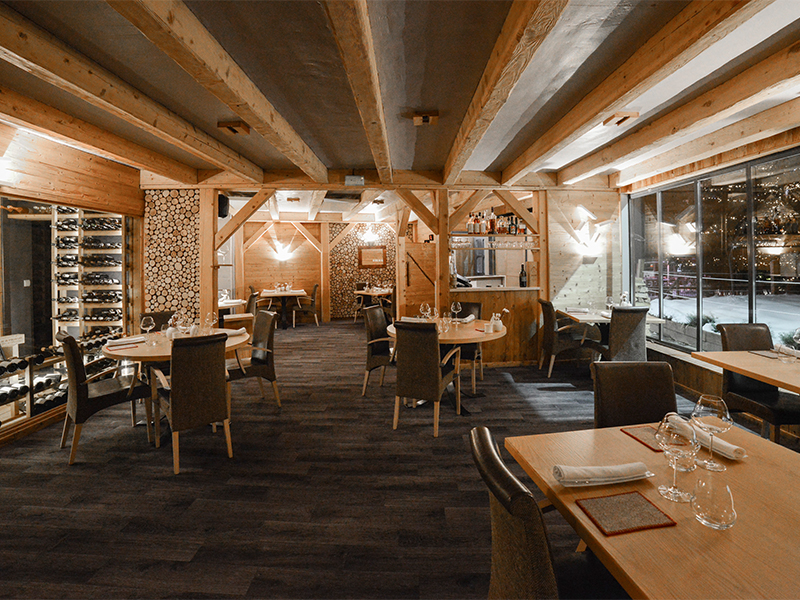 The alpine-inspired decor at Le Farcon imbues a rustic vibe cottage-chic vibe to the space. (Image Credit: Le Farcon) 