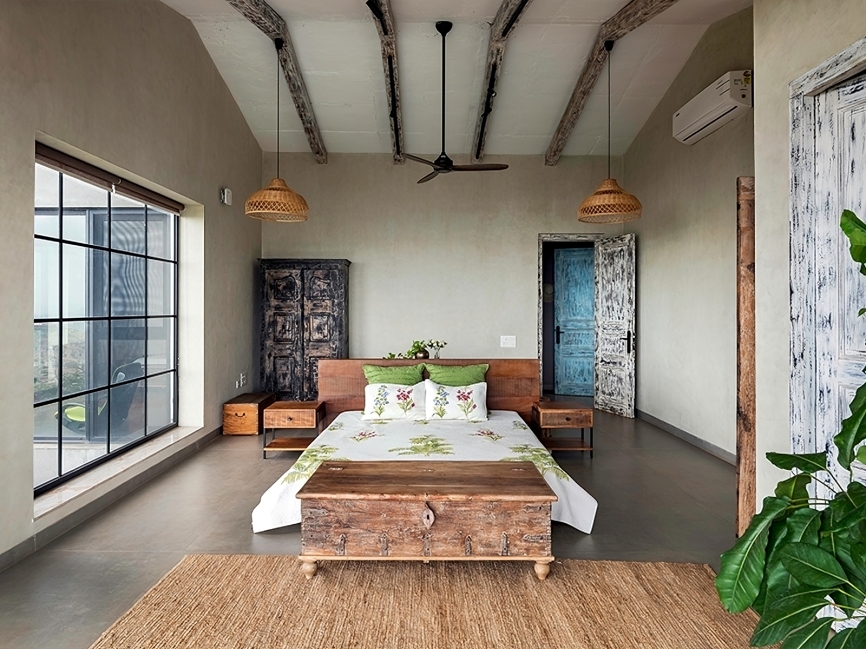 A serene bedroom featuring a Ralph Moretti-designed bed and side tables, muted-toned walls by Asian Paints, and soft furnishings from Plank and Weave. (Image Credits: Retiesh Ramaiyah)