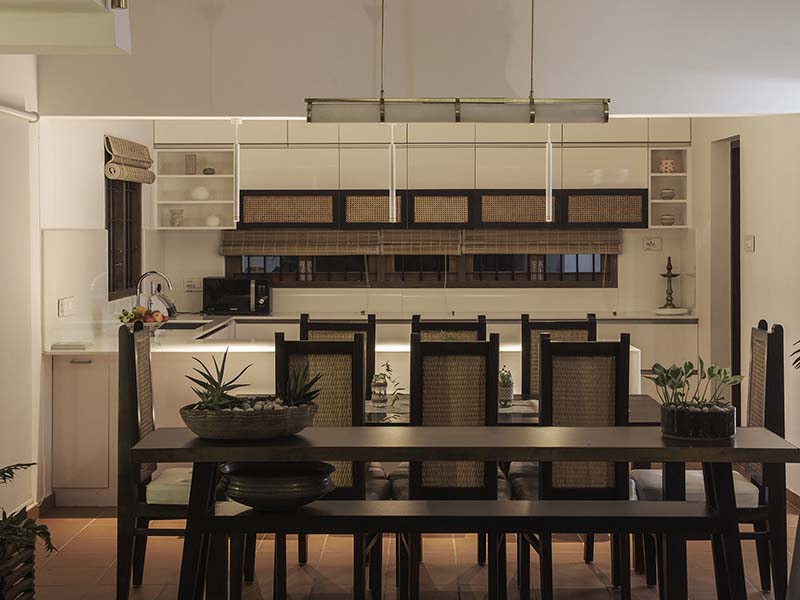 Use of wicker seen throughout the house including the dining chairs at this Kerala home designed by Foundation F.L.O.D and JKM Design Consortium (Image Credits: Syam Sreesylam)