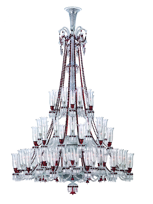 The 84-light Zénith chandelier, designed by Philippe Starck in the 19th century, has graced palaces and grand homes, with Baccarat’s signature red crystal adding a bold accent to its clear pendants. (Image Credit: Baccarat) 