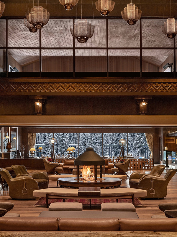 At the heart of the lounge sits a circular, glass-encased live biofuel fireplace with zero carbon emissions—a striking focal point where guests gather to share warmth and linger in conversation. ( Image Credit: The Khyber Himalayan Resort & Spa)
