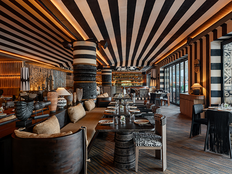 A mix of motifs, textures, and materials—mosaics, leather, fabric, and stone—adds layered depth and unexpected visual intrigue, all wrapped in a bold black-and-white palette. ( Image Credit: Inka)