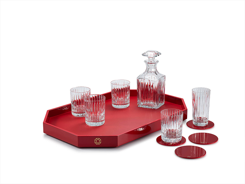 The octagonal tray, paired with red Harmonie tumblers and a whiskey decanter, makes a bold statement—perfect for festive toasts and a luxe upgrade to any bar setup. ( Image Credit: Baccarat)