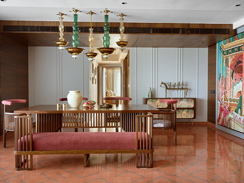 A tactile harmony of cane, repurposed teak by Hari Om Good Work, and handcrafted pendant lights by Hive by Shivangi S brings layered warmth to the dining space. (Image Credits: Rohit Mendiratta) 