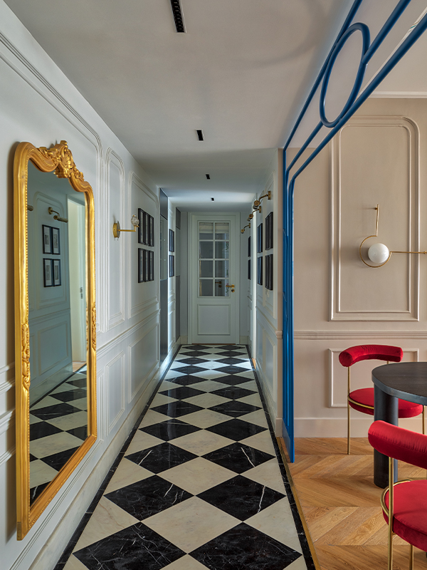 In Emily in Paris, inspired by Noorein Kapoor, the corridor features a sense of symmetry with a living area on one side and a gold-framed mirror sourced from Parrot and Lily on the other side. (Image credit: Pulkit Sehgal)
