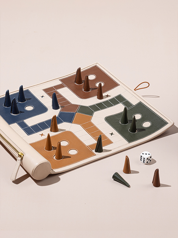 The Handcrafted Ludo Game by The Leather Garden is the perfect companion for family vacations. Price: ₹ 5900 (Image Credits: Vindhya Singh)