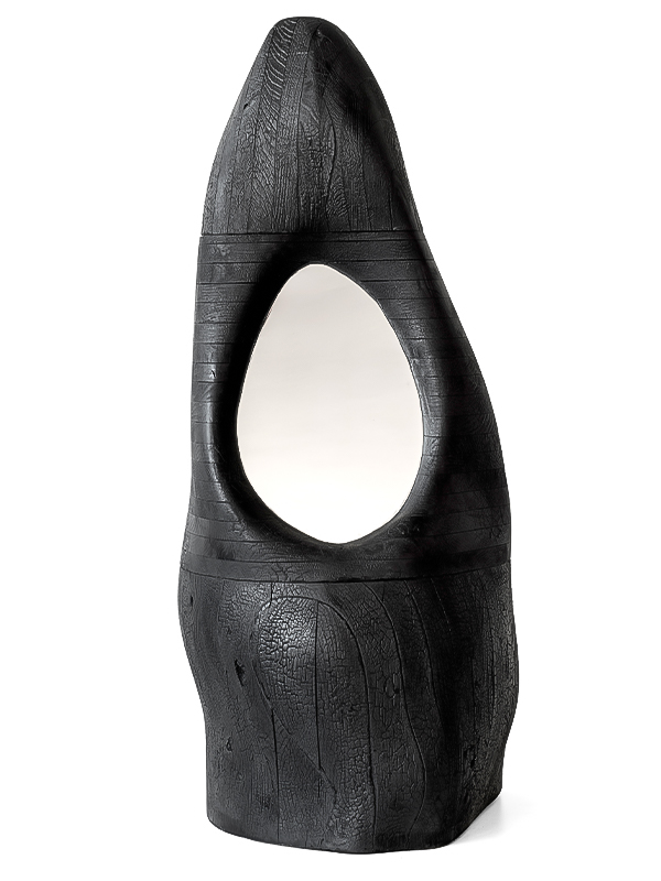 The Monolith mirror commands attention as a sculptural sentinel carved from charred white oak. Price: ₹ 9,00,000 (Image Credits: Popcorn Atelier) 
