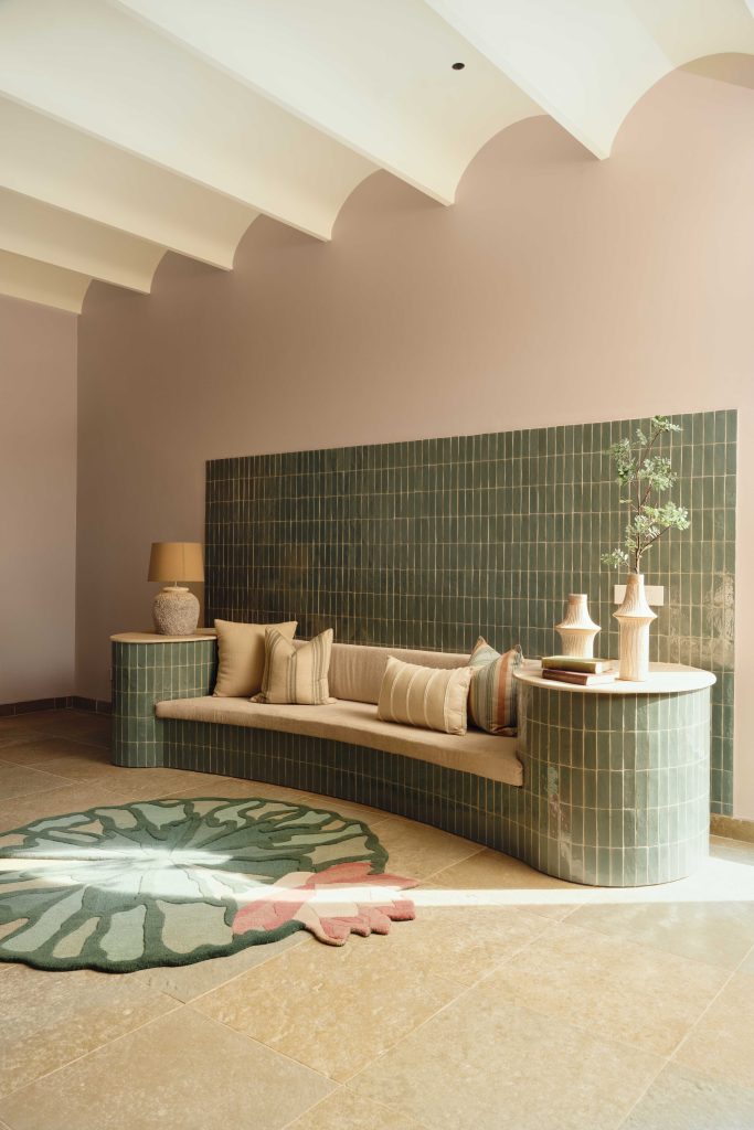 A custom green-tiled bench nook designed by Aarti Dariwal in response to the client’s request for fixed, built-in seating. (Image Credits: The Matter Studio) 