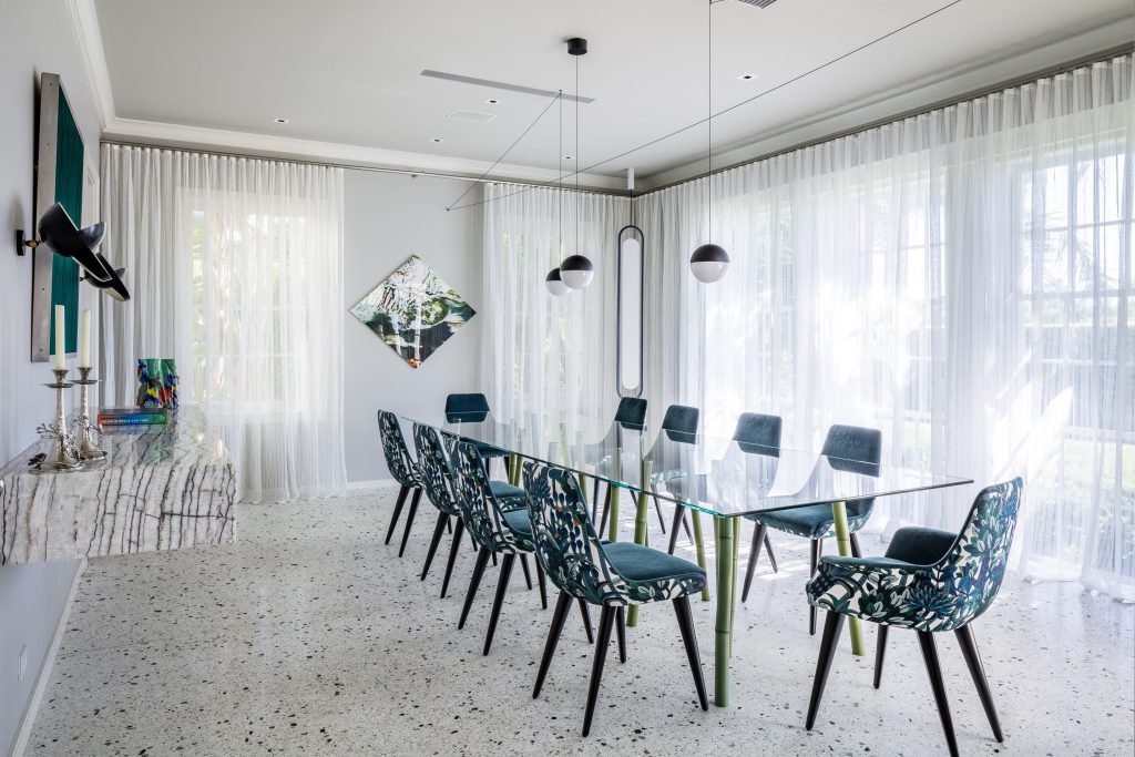 The dining table at the Miami residence, designed by Reddy, is the perfect space for communal dining, with light filtering through the colossal windows embodying her ethos of Vaastu. (Image Credits: Kris Tamburello)