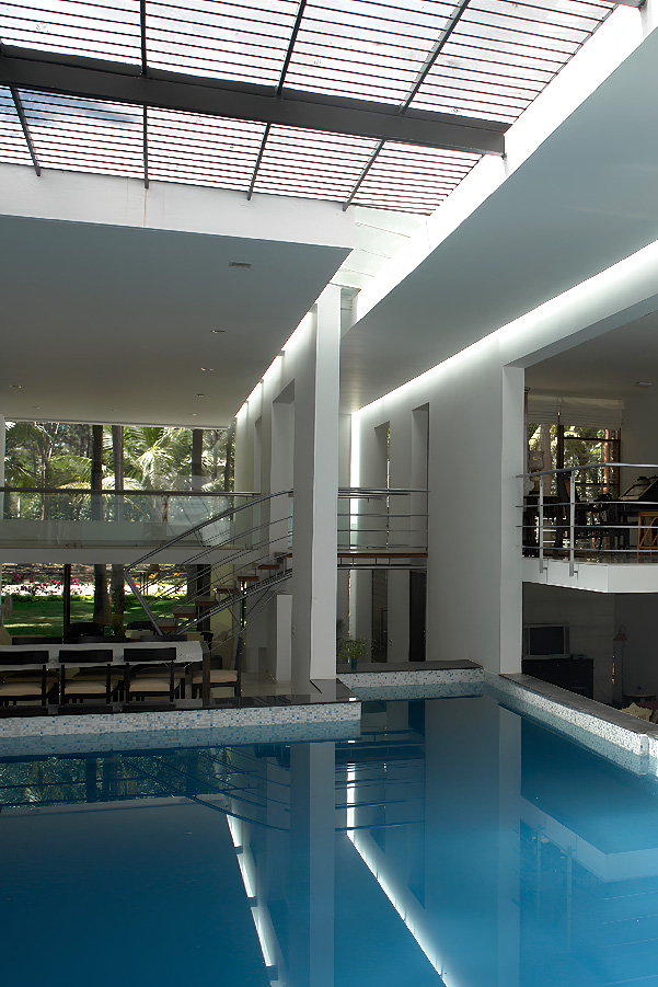 Elements like the glazed ceiling, cement walls, and mosaic tiles were chosen for their timeless aesthetic. (Image Credit: Ochre Architects) 