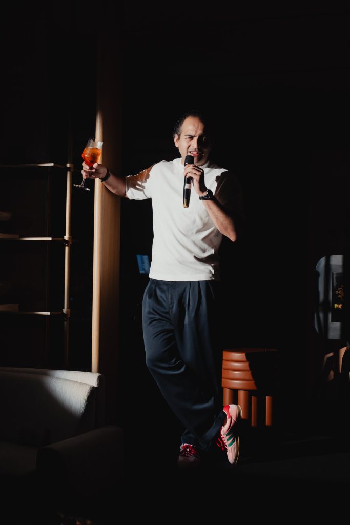 In frame, Hersh Pitroda, founder of Burosys, captivating guests with a surprise live performance, adding an unexpected and memorable moment to the evening. (Image Credits: Design Pataki) 