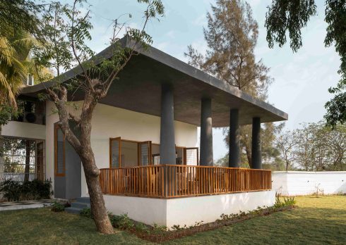 Conceived by MuseLAB, a restored summer sanctuary on the outskirts of Gujarat pairs earthy textures and an open layout, topped with a roof that one can walk on.