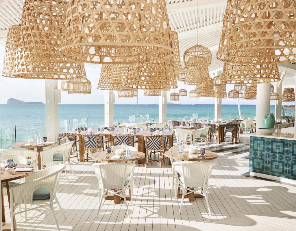 Perched above a tranquil lagoon, Bodrum Blue is a Turkish overwater restaurant serving panoramic views of the northern islands. (Image Credit: LUX* Grand Gaube)