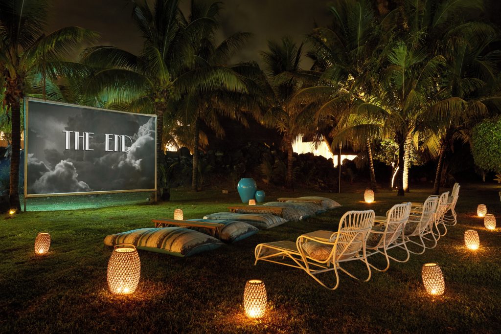 Open-air movie nights with your favourite travel buddy, set to the soothing murmur of the beach, are moments to treasure. (Image Credit: LUX* Grand Gaube) 