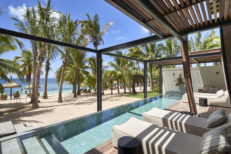 The outdoor garden decks of the LUX* Pool Villas feature a heated pool, an open-air barbecue, and blend seamlessly into the tropical garden that faces the beach. (Image Credit: Tom Fallon)
