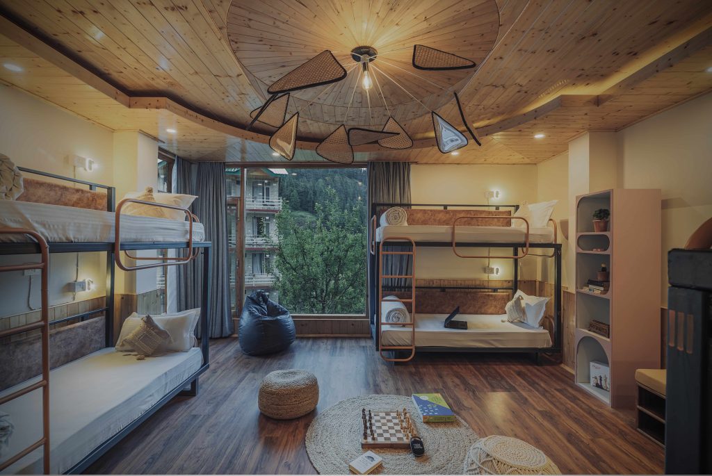 This retreat weaves wooden accents and stone textures into a warm, grounded dialogue with nature. (Image Credits: Tushar Garg) 