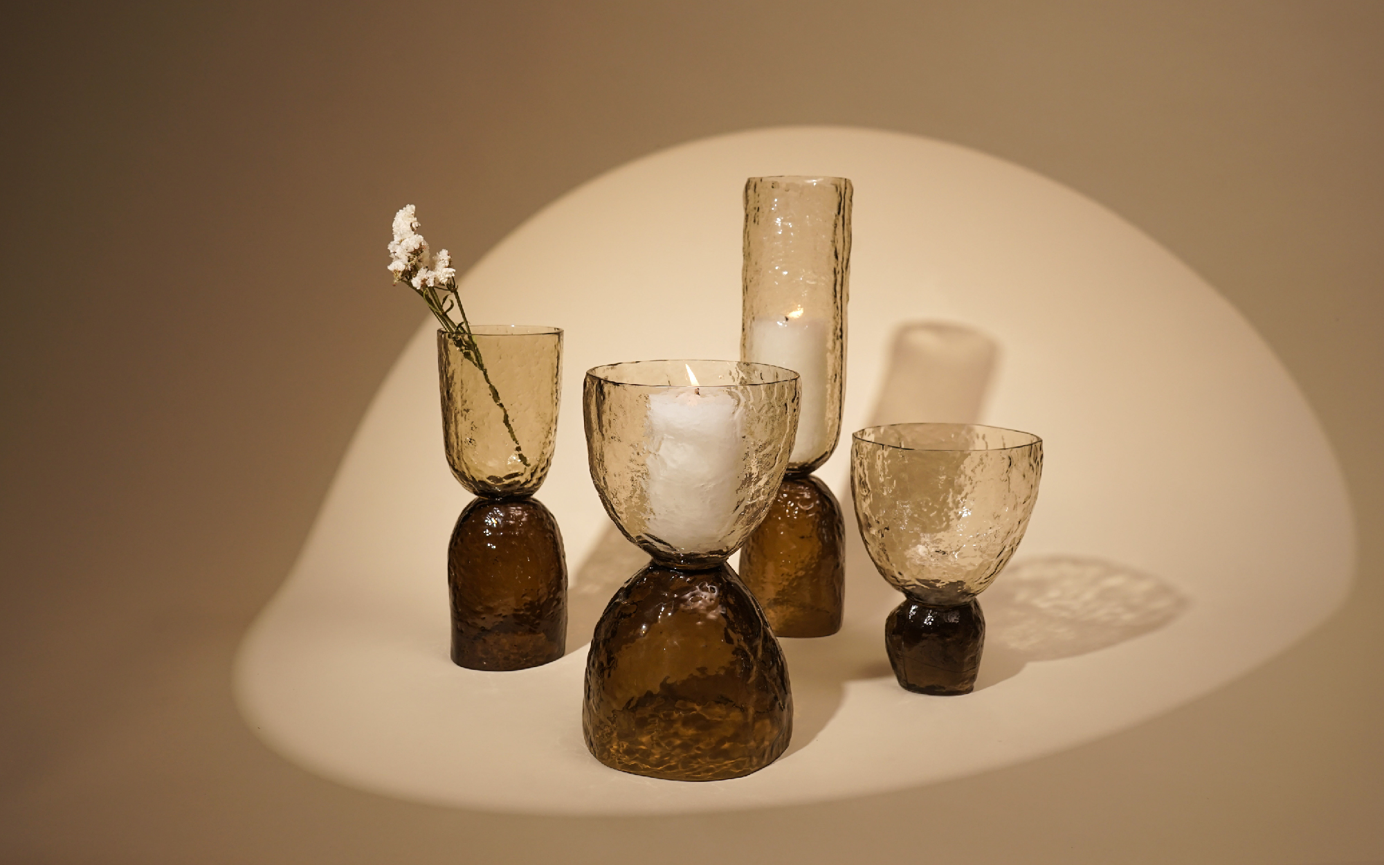 The tinted Axel and Ezra vase sets feature a wabi-sabi facade with organic forms and subtle ombre. (Image credit: Muun Home)