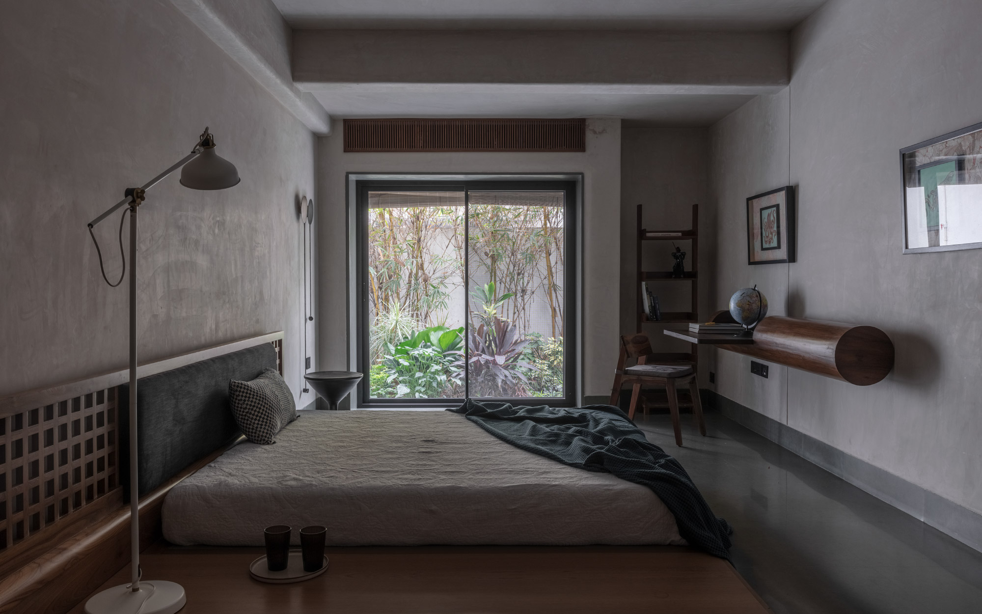 The son’s bedroom houses a bespoke platform bed with a checkered headboard and a log-form desk, both custom-designed by Sona Reddy Studio. (Image Credit: Pankaj Anand)