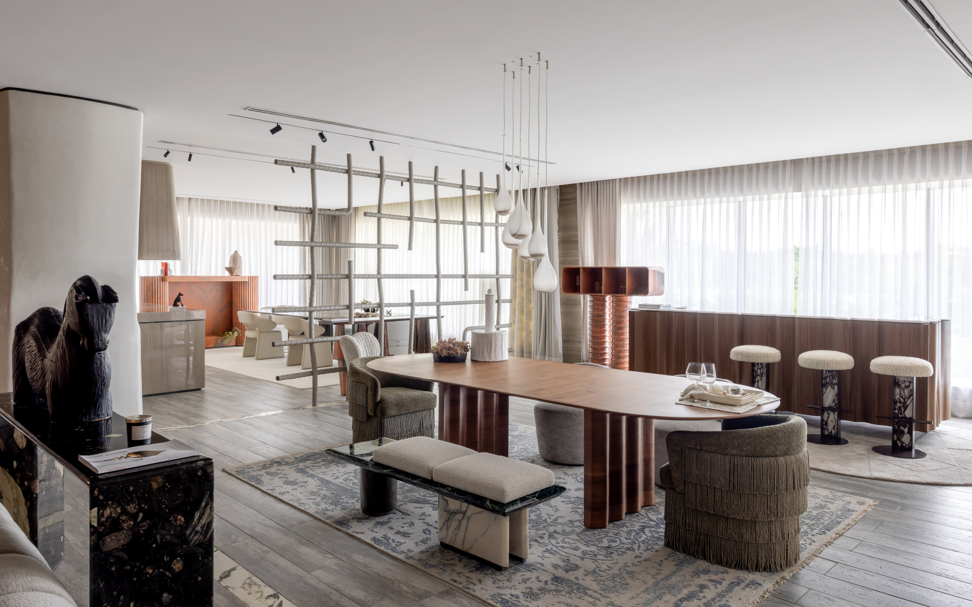 The living and dining room ensembles are underscored by the colossal French windows. (Image credit: Essentia Environments)