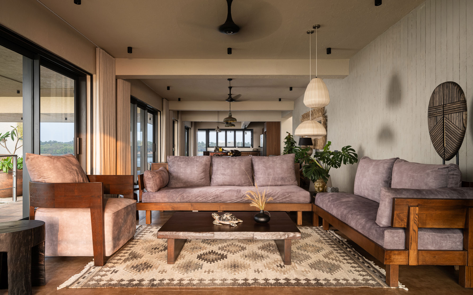 Wooden accents, natural materials and a muted colour palette give the space a rooted vibe. The lighting is from Purple Turtles, Furniture and Furnishings from Creatomy and Petals, Beruru, Chairs & Company and Cane Boutique. (Image Credits: Justin Sebastian, Athul Niranjan)