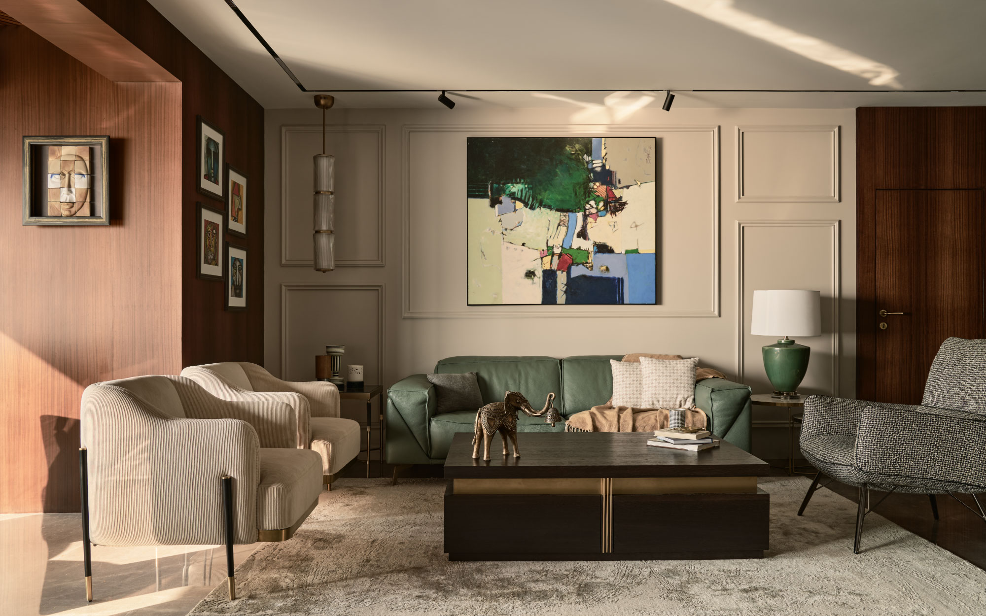 A more casual albeit moodier living space with furniture from Primo, And More Stories, Kerf Living and Natuzzi sits across the formal living area. The carpet is by Jaipur Rugs and the lamps are from Oma and Kumar Lamps. (Image Credits: Yadnyesh Joshi)