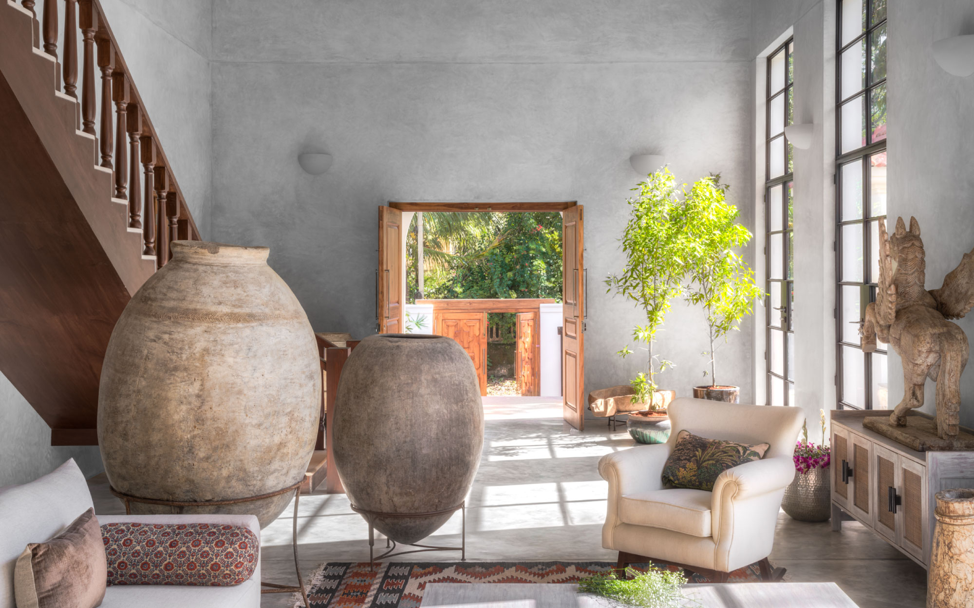 These large, vintage storage urns imbue a sense of timelessness to the interiors. (Image Credits: Rangeela)