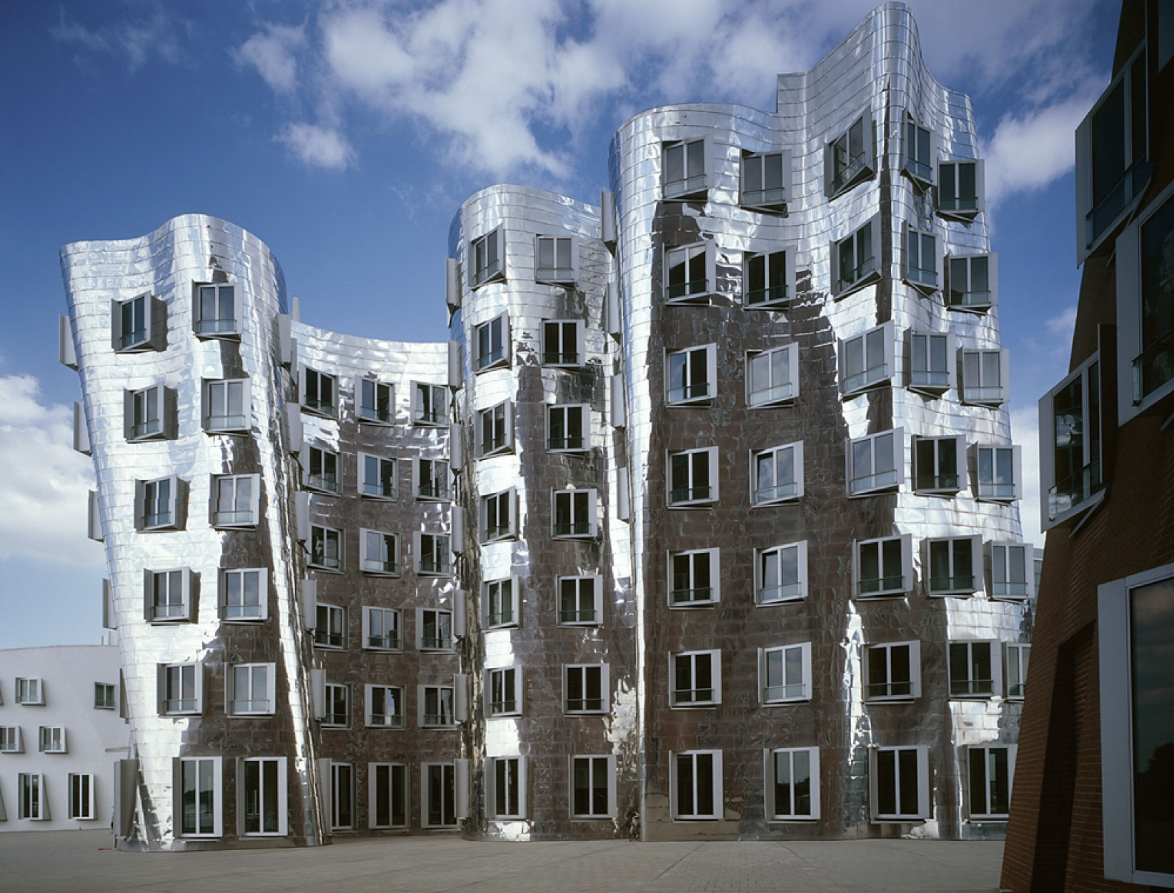The Neuer Zollhof complex, also known as the Gehry Buildings in Düsseldorf, Germany is known for its deconstructivist style. (Image Credits: Peter Knaup)