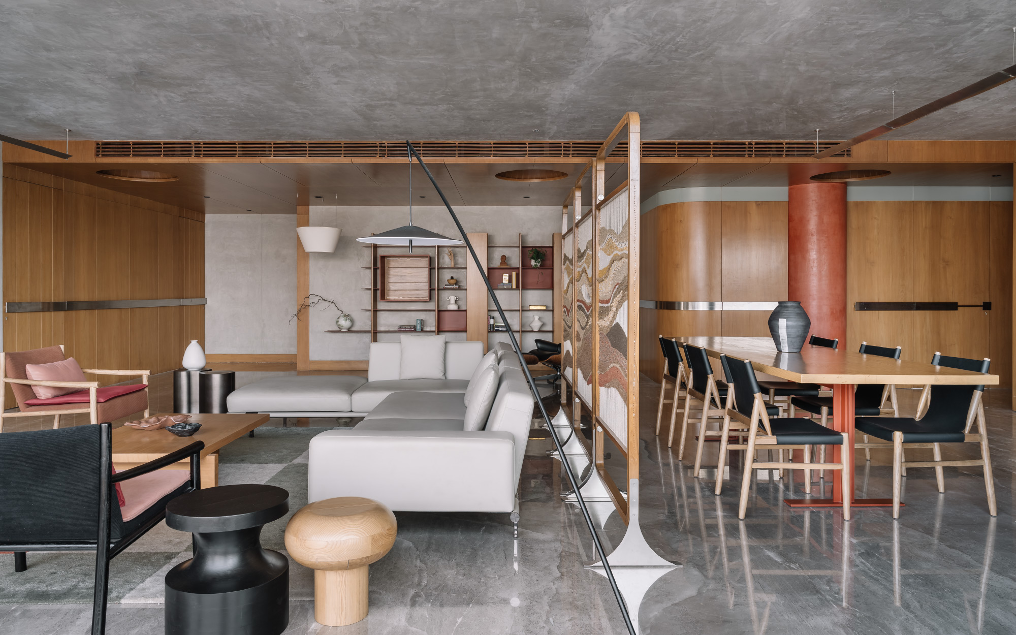 The furniture including the dining table was custom-made by H+A Studio and Shiv Shakti Furniture, while some pieces were sourced from HM Furniture. The woven partition is by Dori by Madhri. The lighting is custom H+A Studio and Smart Light. (Image Credit: Ishita Sitwala)
