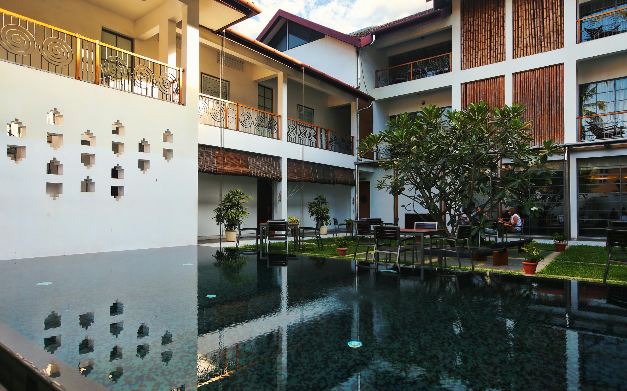 The tranquil outdoors at Eight Bastion, where garden calm meets poolside leisure. (Image Credits: CGH Earth)
