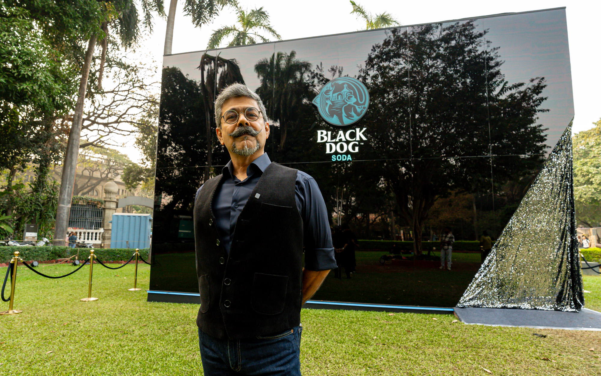 Architect Arzan Khambatta with the Black Dog Soda installation that unfolds as a sculptural dialogue between form, light, and landscape, setting a refined architectural tone from the very first glance. (Image Credits: MBP Media)