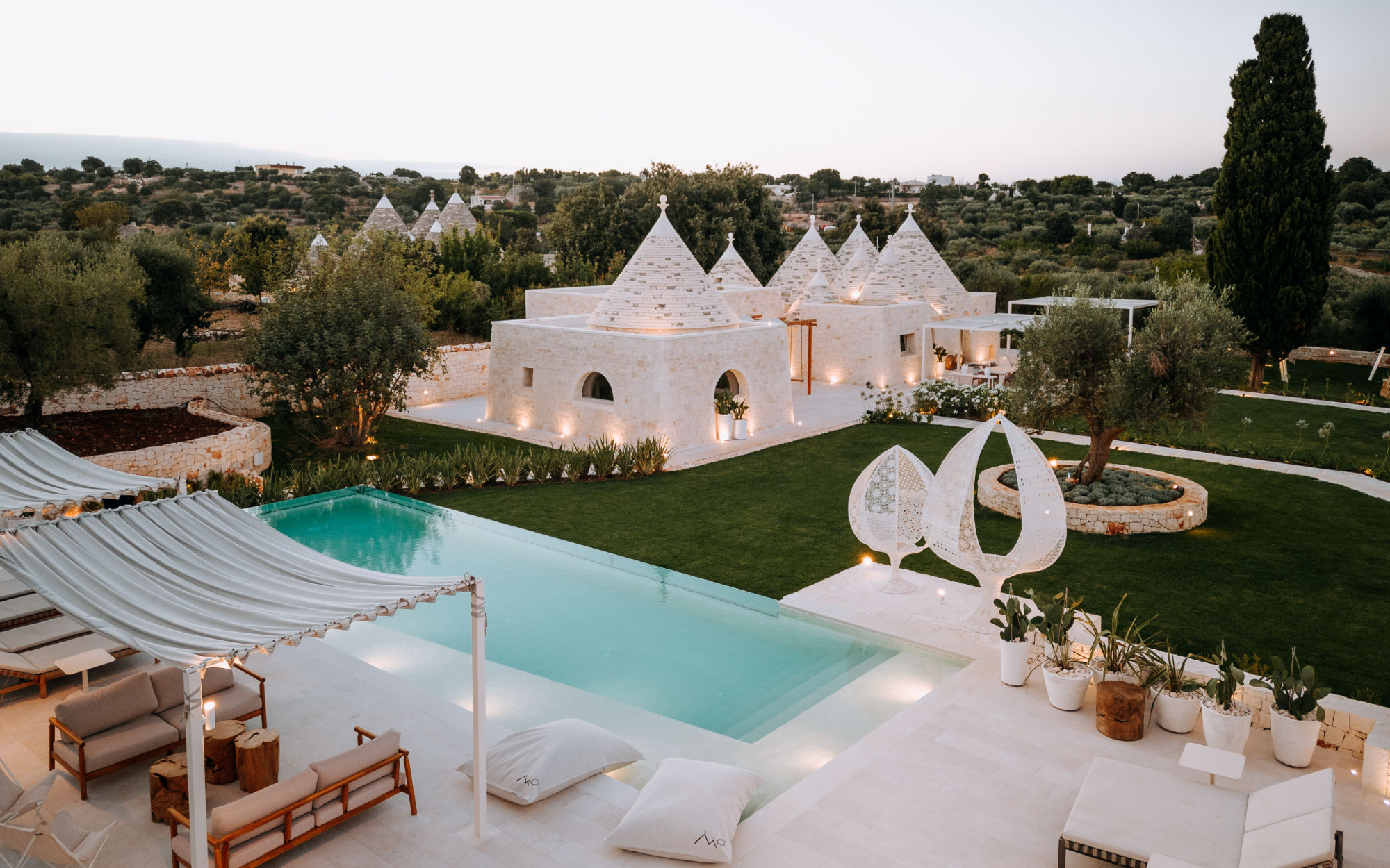 Conical rooftops, hand-crafted stone walls, and minimalist interiors reflect the quiet beauty of rural Italy. (Image credits: Mandarin Oriental Exceptional Homes)