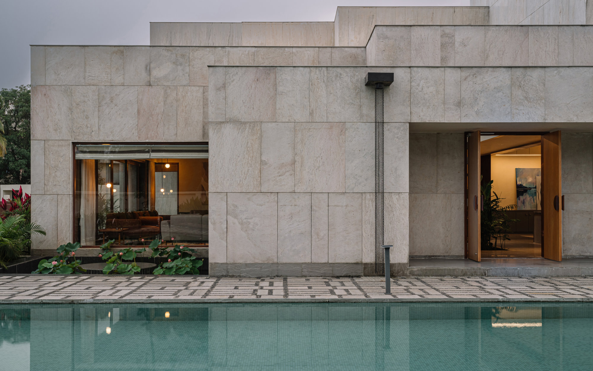 A narrow, linear courtyard links the dining and living areas, extending seamlessly toward the pool deck. (Image credit: Ishita Sitwala)