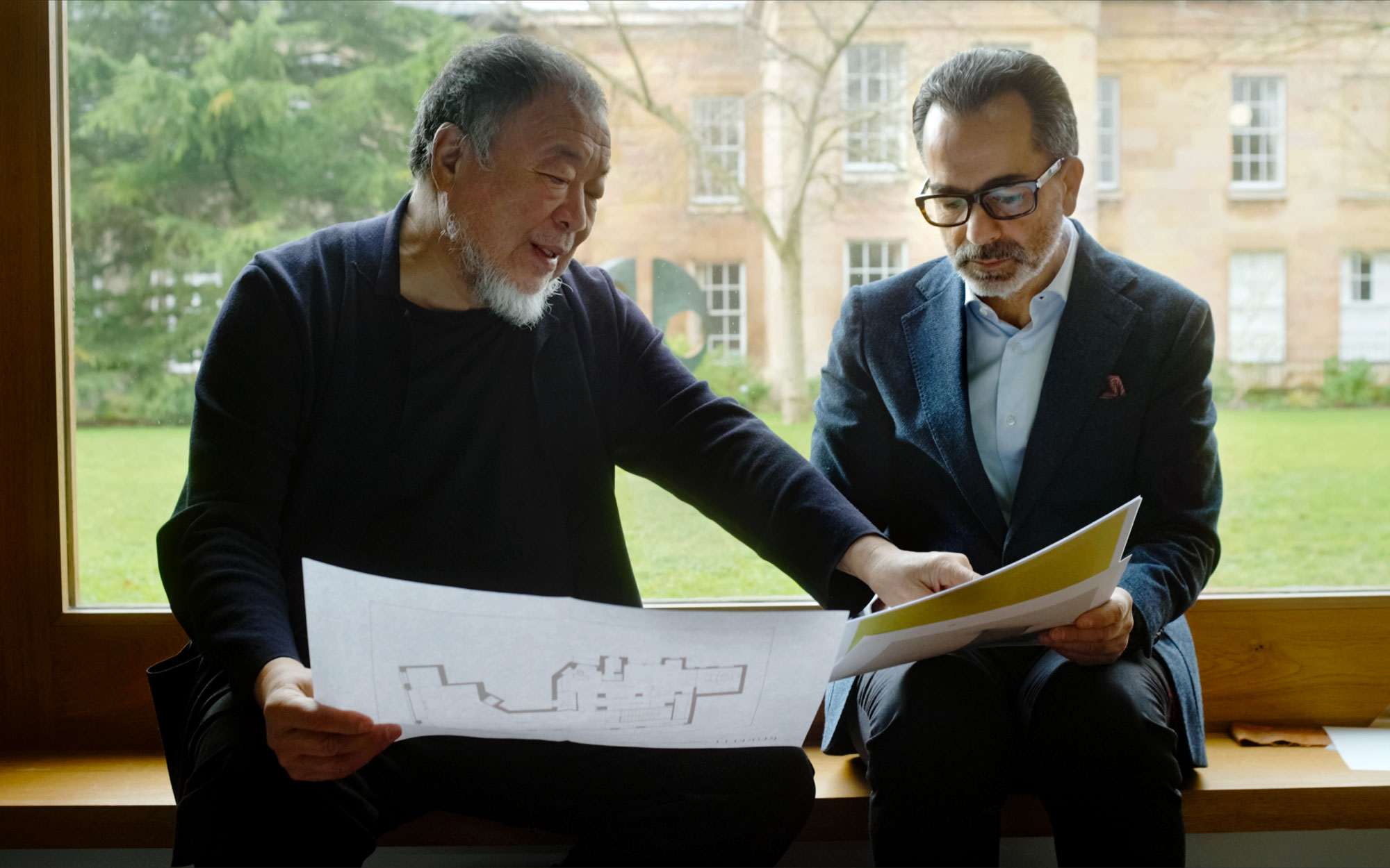 Ai Weiwei and Nicolò Favaretto, CEO of fabric house Rubelli. (Image credits: Felipe Sanguinetti)