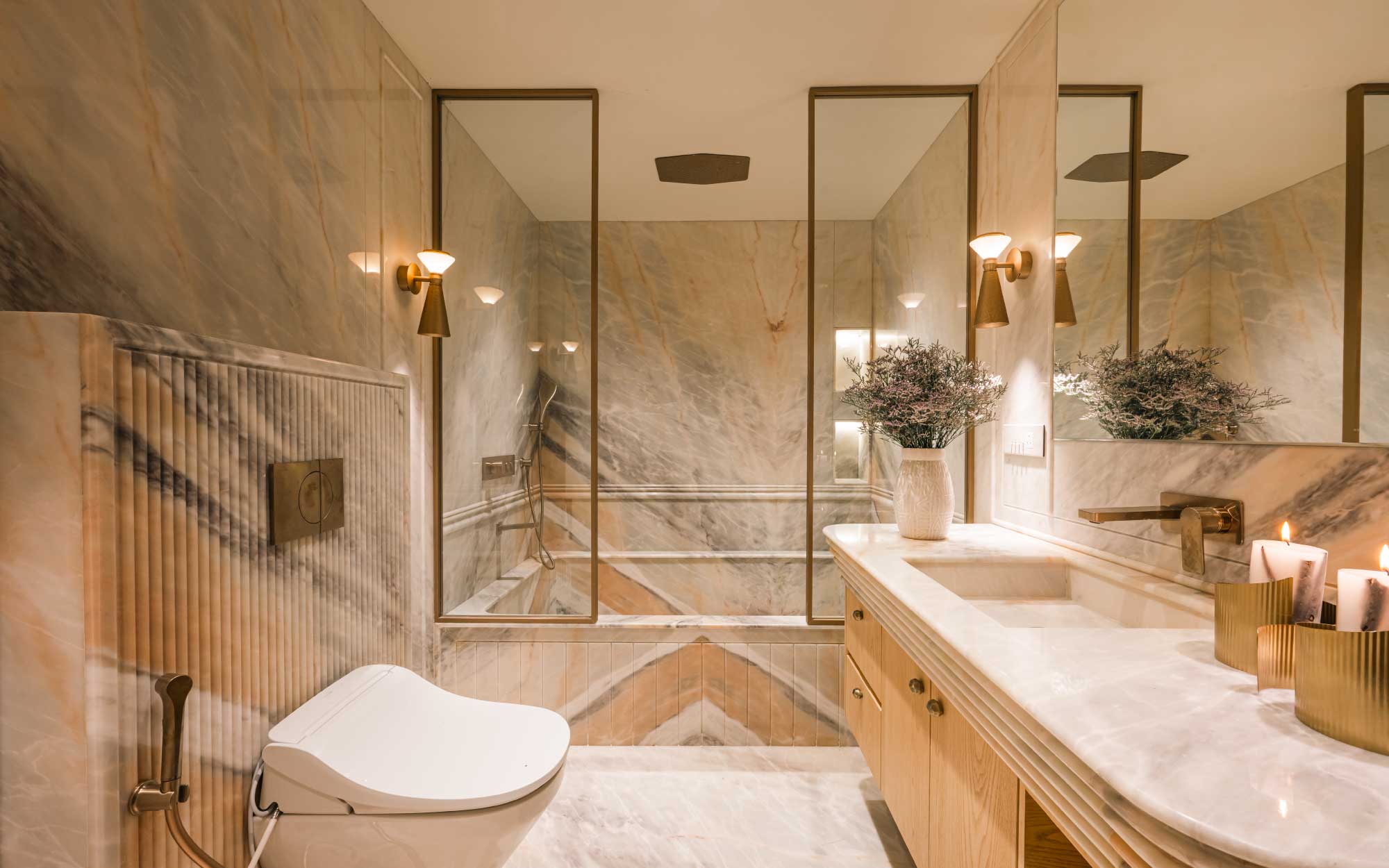 The bathroom exhibits a regal quality owing to the all-marble palette. (Image credits: Murtaza Gandhi)