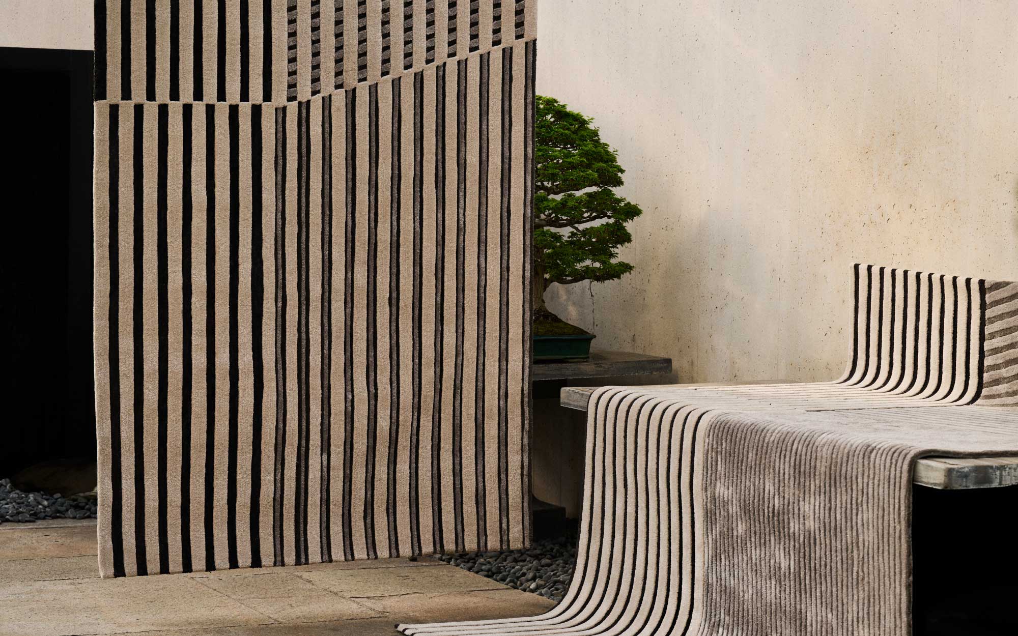 FACES is a nuanced collection of rugs capturing light, materiality, and spatial rhythm through handcrafted surfaces. (Image Credits: Jaipur Rugs)