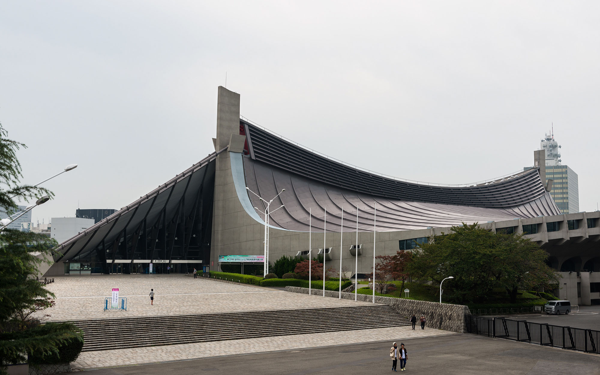 Completed for the 1964 Tokyo Olympics, the Yoyogi National Gymnasium is defined by its iconic tensile roof structure suspended from sweeping steel cables. (Image Credits: Andrés García from Flickr) 