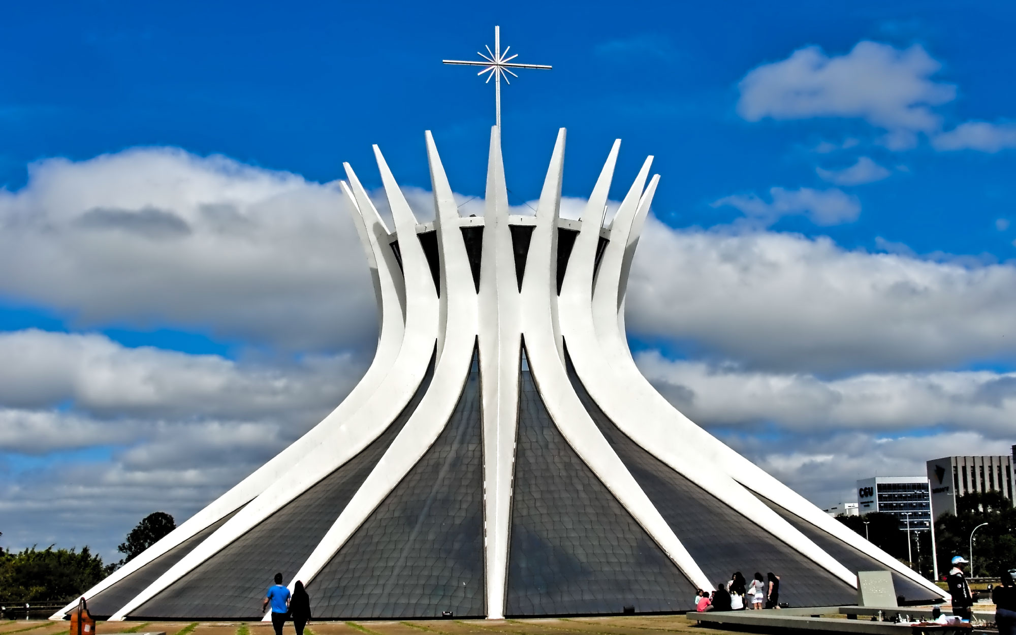 The Cathedral of Brasília rises as a crown of sixteen curving concrete columns, forming a luminous sanctuary where architecture and light converge. (Image Credits: Heitor de Bittencourt from Flickr) 