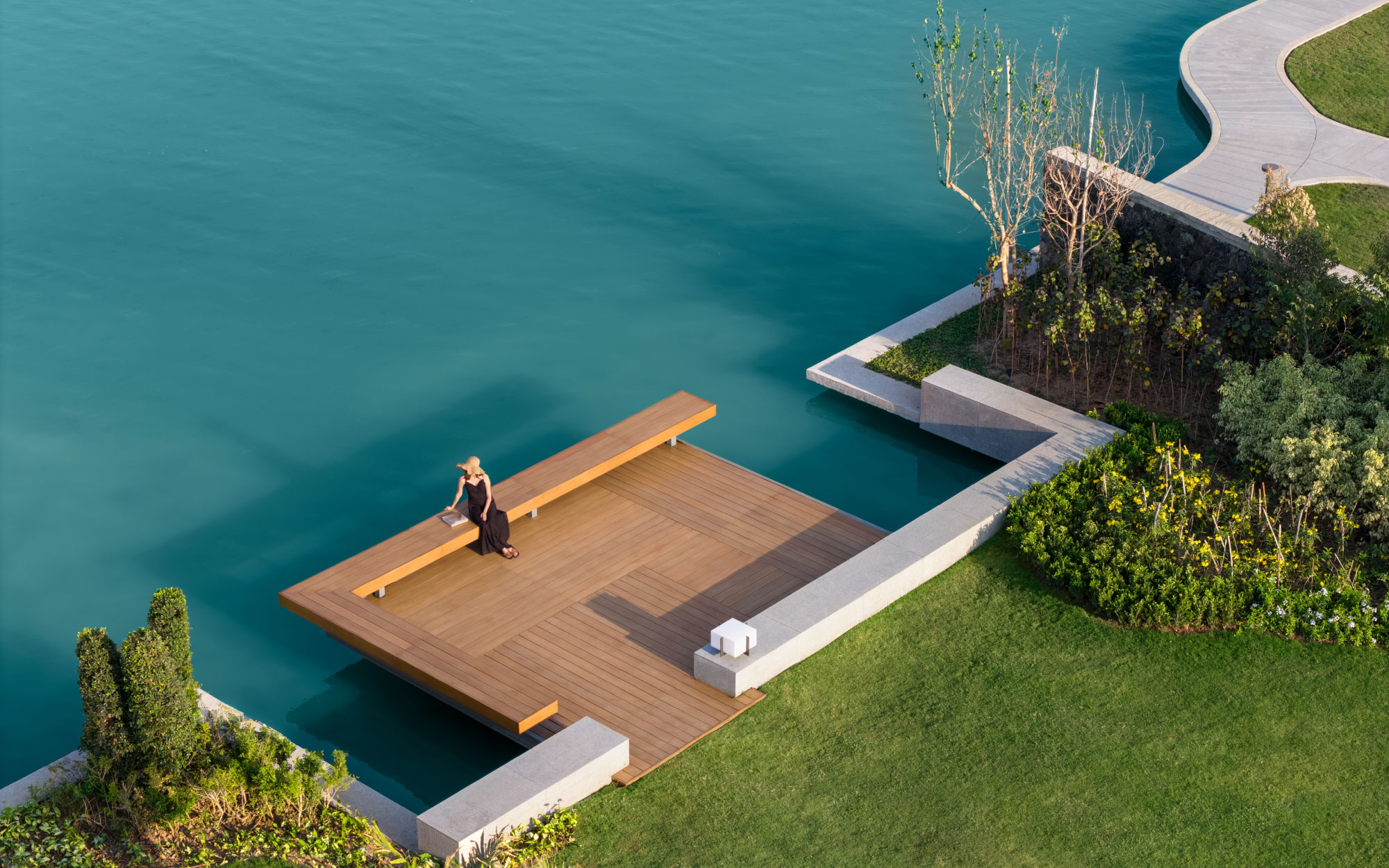Perched along the landscape, private sitting decks and shaded alcoves offer intimate pockets for contemplation, where the water, breeze, and horizon quietly take centre stage. (Image Credits: Suryam Developers) 